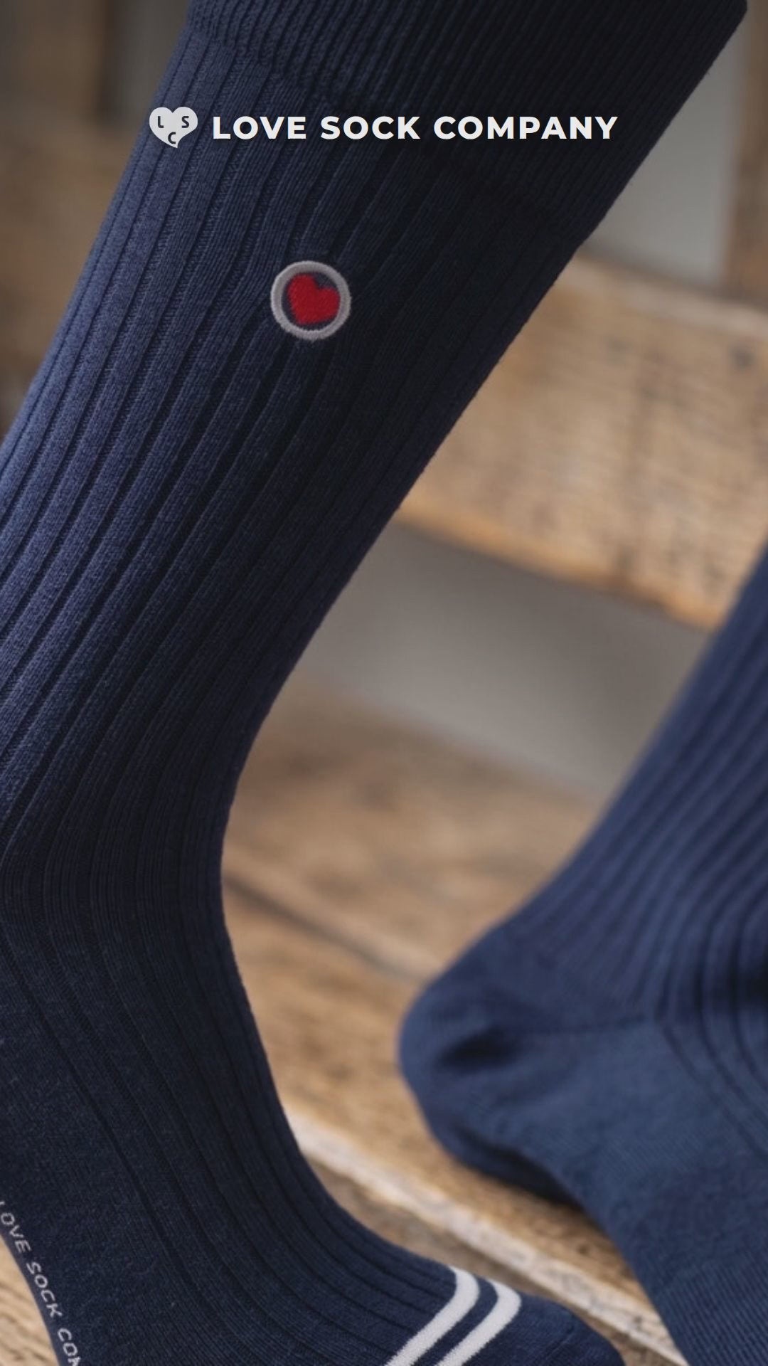 Close-up video of Love Sock Company Ribbed Solid Navy men's mid-calf dress socks, organic cotton