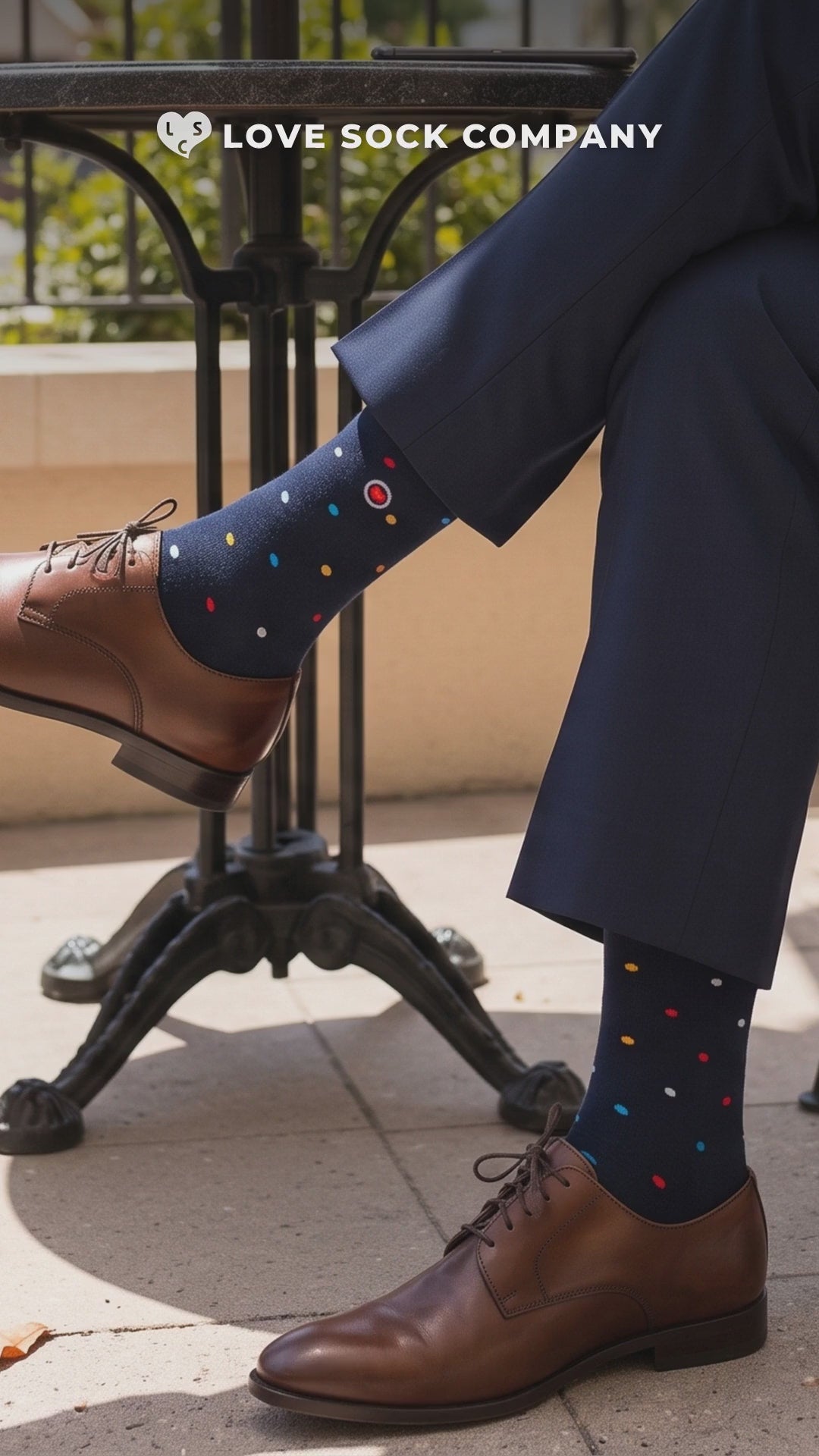 Video of Love Sock Company Mini Polka Navy men's mid-calf dress socks worn with a navy suit